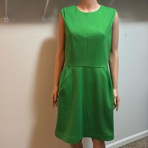 Cute sleeveless green dress with exposed gold zipper up the back size 12